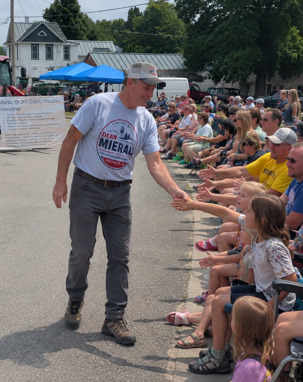 Dean Mierau greeting neighbors and kids at a Houston County parade