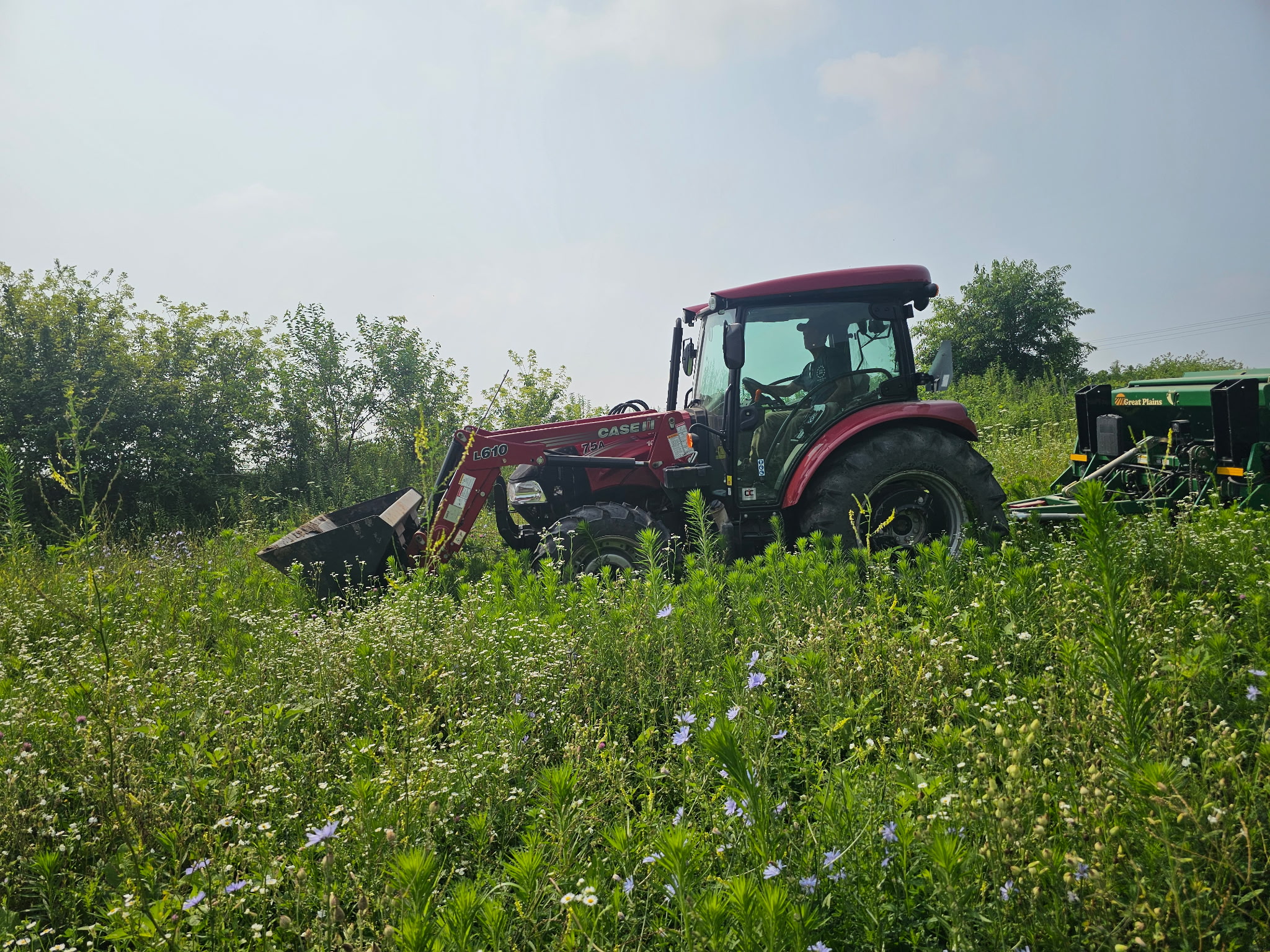 Dean Mierau working his land on a tractor